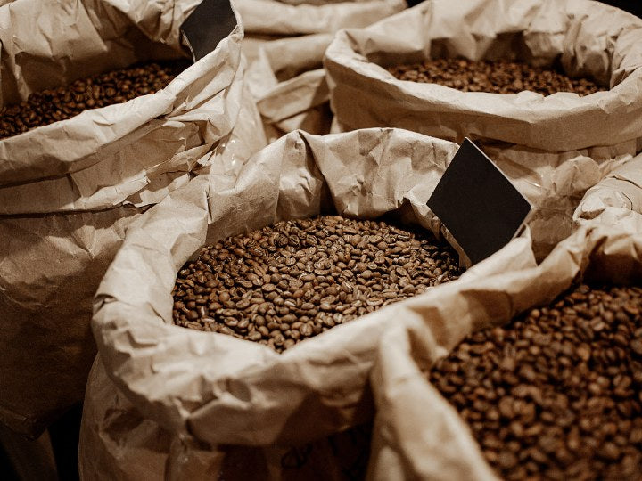 Bags of freshly roasted Beach Bros Coffee beans