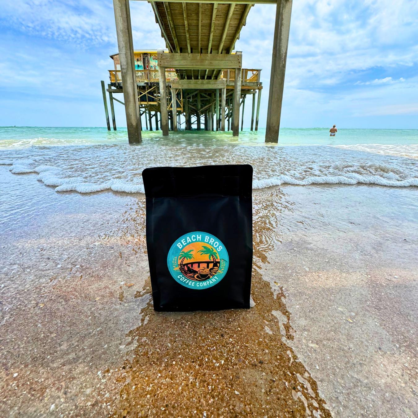 Photo of coffee bag under pier with wave approaching